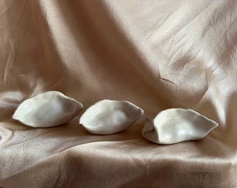 porcelain dumpling, ceramic hand folded dumpling paper weight object, potsticker, jiaozi, momo, gyoza, mandu {one dumpling}