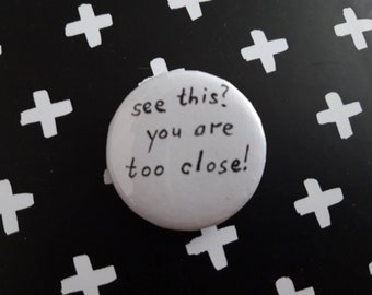 See this? You are too close - pin badge button