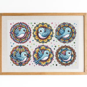 May include: A framed print displaying six blue birds set within decorative mandala patterns. The birds are light blue, and the mandalas feature yellow, pink, and blue hues. The artwork is presented in a wooden frame.