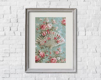 May include: Framed artwork featuring a vintage hand fan against a floral background. The fan is white and pink, with a detailed design. The background is a light teal color with pink roses and green leaves. The frame is silver.