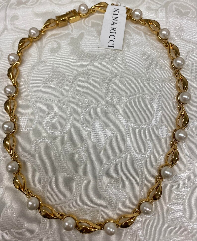 Nina Ricci Pearl Necklace. Triple 22kt 
