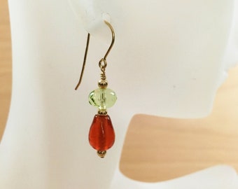 Glass earrings in peridot green and orange