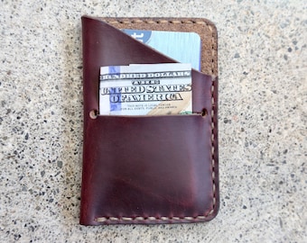 burgundy Horween steer hide credit card wallet. made by hand in Ithaca, NY. sewn with a saddle stitch.