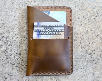 olive Horween steer hide credit card wallet. made by hand in Ithaca, NY. sewn with a saddle stitch.