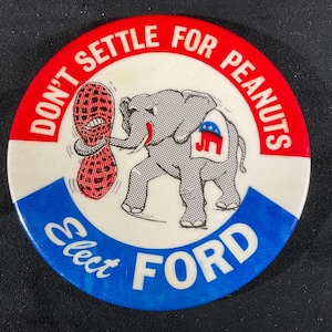 May include: A vintage political campaign button with a red, white, and blue color scheme. The button features an illustration of a gray elephant holding a peanut, with the text "DON'T SETTLE FOR PEANUTS" and "Elect FORD".