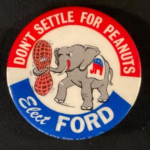 May include: Vintage political campaign button with a red, white, and blue design. The button features an elephant holding a peanut and the text "DON'T SETTLE FOR PEANUTS" and "ELECT FORD".