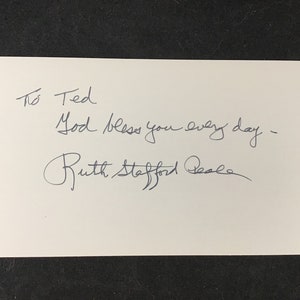 May include: A handwritten note that reads "To Ted God bless you every day - Ruth Stafford Peale"
