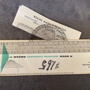 May include: A Weems Mark II Aircraft Plotter with a clear plastic protractor and a ruler. The plotter is made by Weems System of Navigation, Inc. in Annapolis, Maryland. The plotter has a warning label that says "Do not leave this plotter exposed to excessive heat or direct rays of sun for long periods of time."