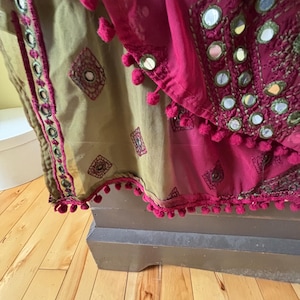 May include: A rustic wooden sign with the text "Welcome to our home" in white lettering. The sign features a distressed finish and a simple, inviting design, perfect for entryway decor.