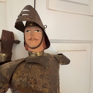 Authentic vintage Sicilian knight puppet with age-worn armor and a noble face that shows the character and history of true Opera dei Pupi.
