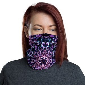 May include: A purple and blue face mask with a mandala design. The mask is made of a soft, breathable fabric and is comfortable to wear.
