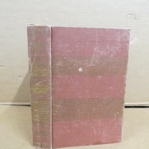 May include: A vintage book with a faded red cover and spine. The spine features gold lettering and the title "Introducing Aeronautical Drafting." The cover has horizontal brown stripes. The book is standing upright.
