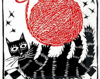 Cat Playing With a Ball of Yarn