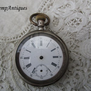 Progetto di restauro di un orologio da tasca antico in argento autentico del 1900