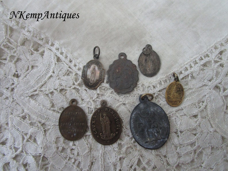 Antique religious pendant x 7
