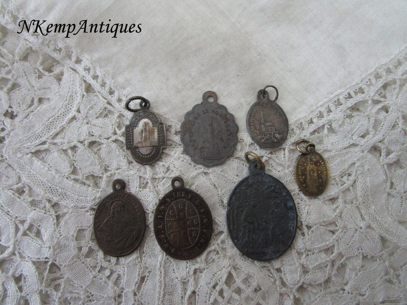 Antique religious pendant x 7
