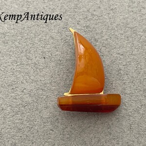 Real old amber boat brooch sailing boat