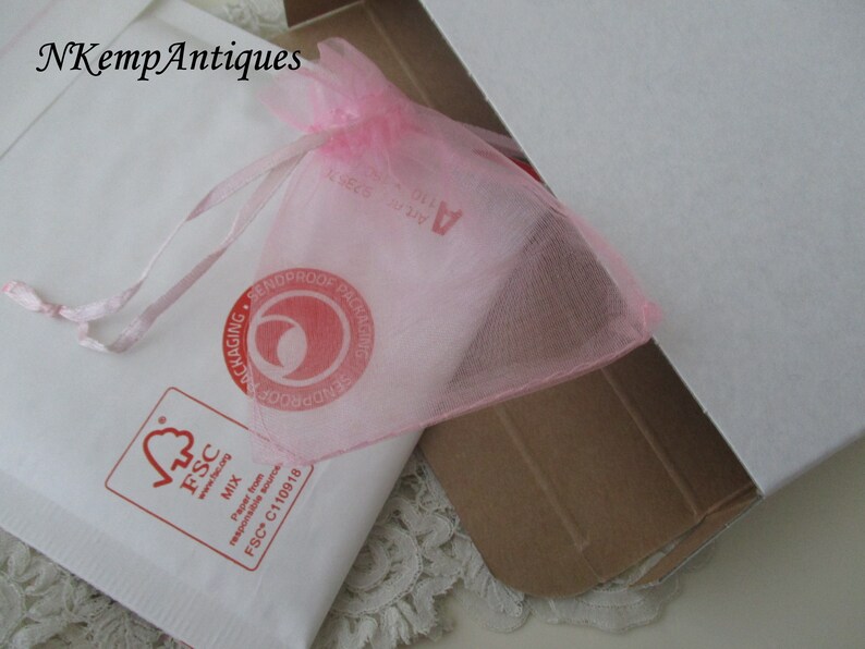Antique heart pendant and chain on original card