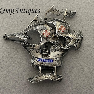 Old sterling silver filigree ship ornament