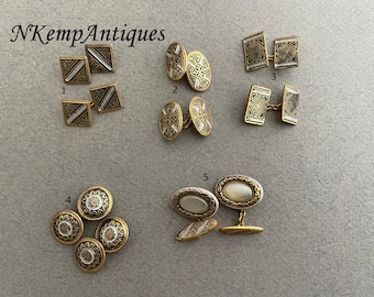 May include: A collection of ten gold cufflinks with various designs. The cufflinks are arranged in five pairs, each pair numbered 1 through 5. The cufflinks feature intricate patterns and designs, including geometric shapes, floral motifs, and a pair with a mother-of-pearl inlay.