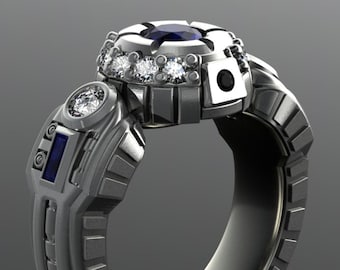 R2D2 engagement ring in hypoallergenic grey gold with diamonds and very fine blue sapphires. The most durable Star Wars wedding ring in 14k