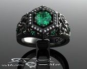 Unique emerald engagement ring in black gold. Art Deco halo and Victorian Gothic filigree scrollwork with ideal cut diamonds. Corvus Ring.