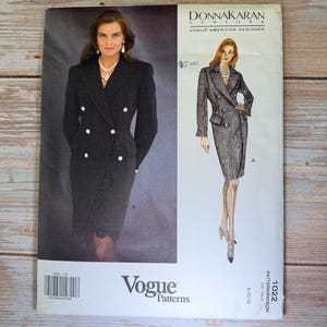 May include: A Vogue Patterns sewing pattern featuring a Donna Karan design. The cover shows a woman in a double-breasted suit and skirt. The pattern number is 1022, with sizes 8-10-12. The cover also includes the text "Vogue American Designer."