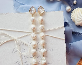 Orecchini pendenti con perle naturali per la sposa. Orecchini lunghi da sposa con perle color avorio.