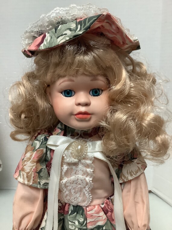 16 Porcelain Doll with Stand Long Curly Blonde Hair Blue Eyes and Peach Floral Dress