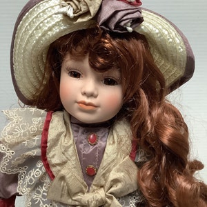 16&quot; Porcelain Doll - Long Red Curly Hair, Brown Eyes, Purple and Brown Dress with Straw Hat