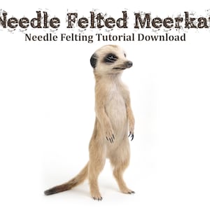 May include: Needle felted meerkat, a tutorial download for creating a realistic meerkat using needle felting techniques. The meerkat is standing upright with its paws together, looking to the right.
