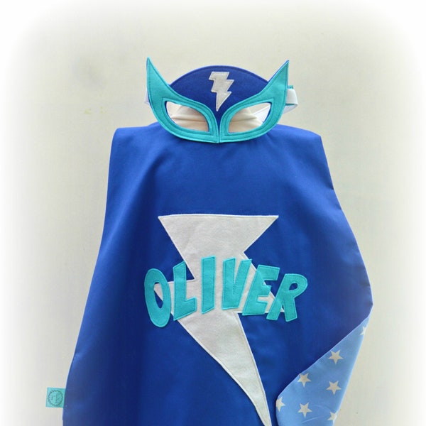 Personalised name superhero cape and mask set, blue lightening bolt