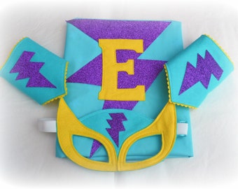 Turquoise, purple, yellow star superhero set cape, mask and cuffs