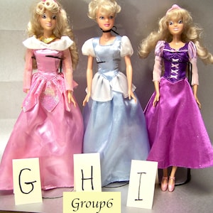 Disney Princess Dolls marked Disney China  choose Aurora Cinderella and Rapunzel dresses