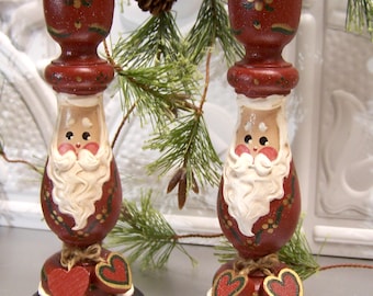 Artisan painted  Wood Santa Candlesticks from the late 1990's Faces in relief