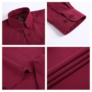 May include: Close-up shots of a burgundy button-down shirt. Details include the collar, buttons, and fabric texture. The shirt has a button-down collar and a classic fit. The fabric appears to be a smooth, woven material.