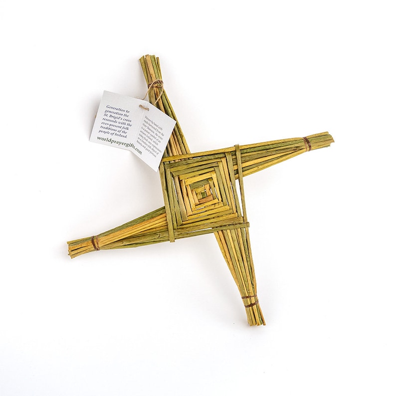May include: A woven straw Celtic cross, also known as a St. Brigid's cross, with a small tag attached that reads "Generations of generations have brought this cross to the world with the reverence of faith and the ancient traditions of the people of Ireland. worldprayergifts.com".