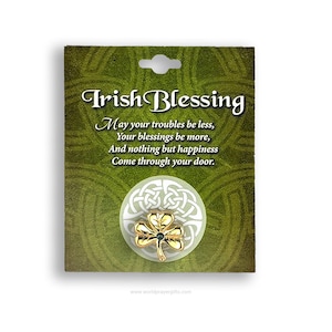 May include: Gold Irish Blessing pin with a green shamrock and a Celtic knot design. The pin is on a card with the text "Irish Blessing" and a poem about happiness.
