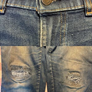 May include: Close-up of blue denim jeans with a button closure and distressed details. The jeans have visible wear and tear, including patches on the knees. The button is a metallic color with the text "Garment Co."