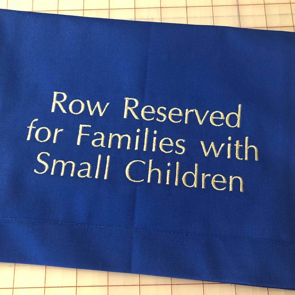 Reserved for Families with Small Children. fabric pew sign / drape, chair scarf / marker, venue, church, auditorium, event