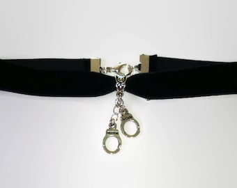 Black velvet choker with silver handcuffs charm pendant detail