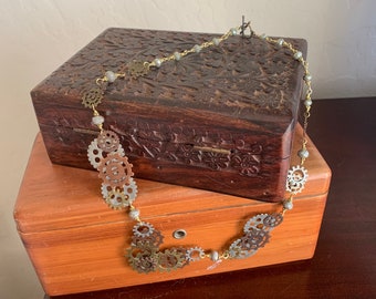 Gears of change necklace