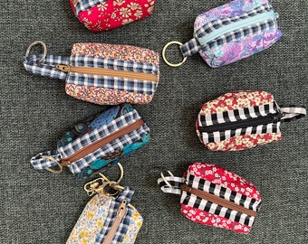 Mini pochette cosmétique pour baume à lèvres Airpod avec fermeture à glissière et porte-clés