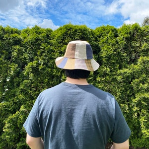 Brown beige taupe gold bucket hat