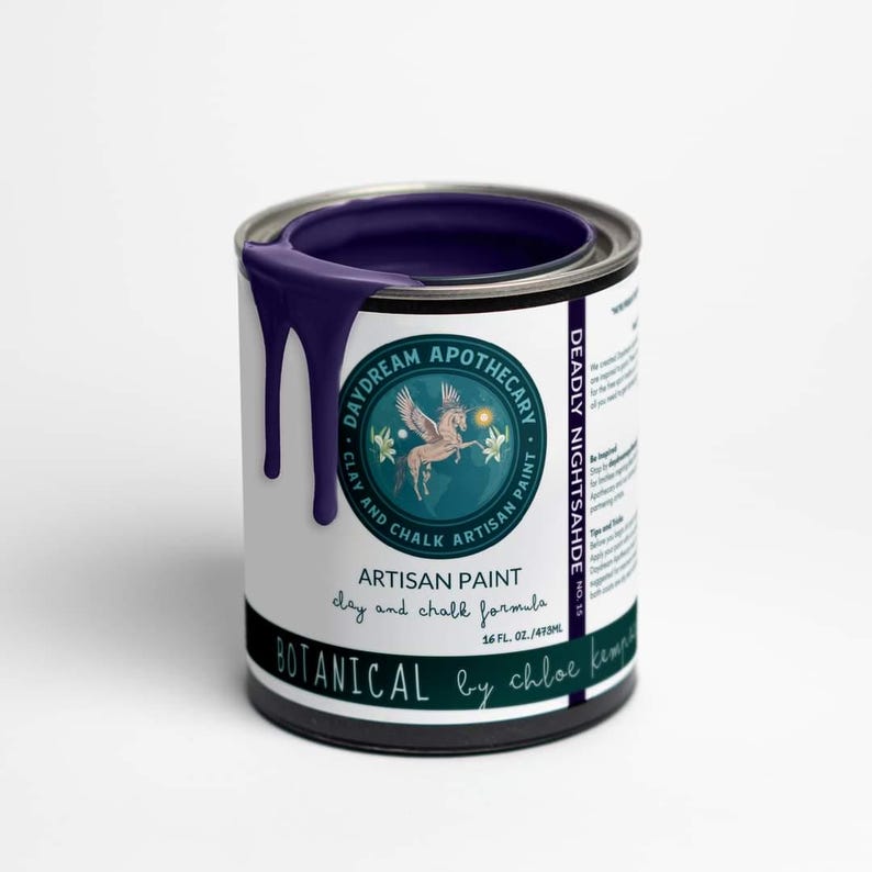 May include: A can of "Deadly Nightshade" artisan paint by Daydream Apothecary. The dark purple paint drips down the side of the can. The label features a circular logo with a winged horse and the text "Botanical by Chloe Kempe". The can contains 16 fl oz / 473ml.