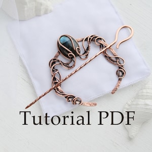 May include: A copper wire wrapped hair stick with a blue gemstone and a loop at the end. The hair stick is on a white surface. Tutorial PDF.