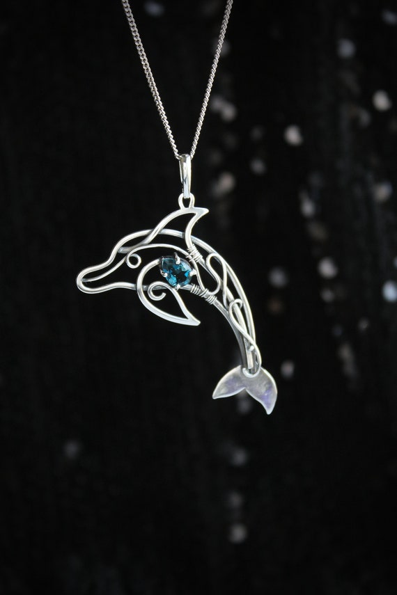 This dolphin necklace makes the perfect silver dolphin charm for sea and animal lovers.