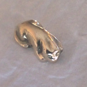 Sleeping cat figurine.