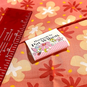 Fold-over, Two-sided Custom Fabric Labels. Place your logo on both sides. These sewing tags fold and are 100% Cotton and fray resistant.