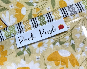 Fold-over, Two-sided Custom Fabric Labels. These sew-on tags fold and are 100% Cotton and fray resistant.